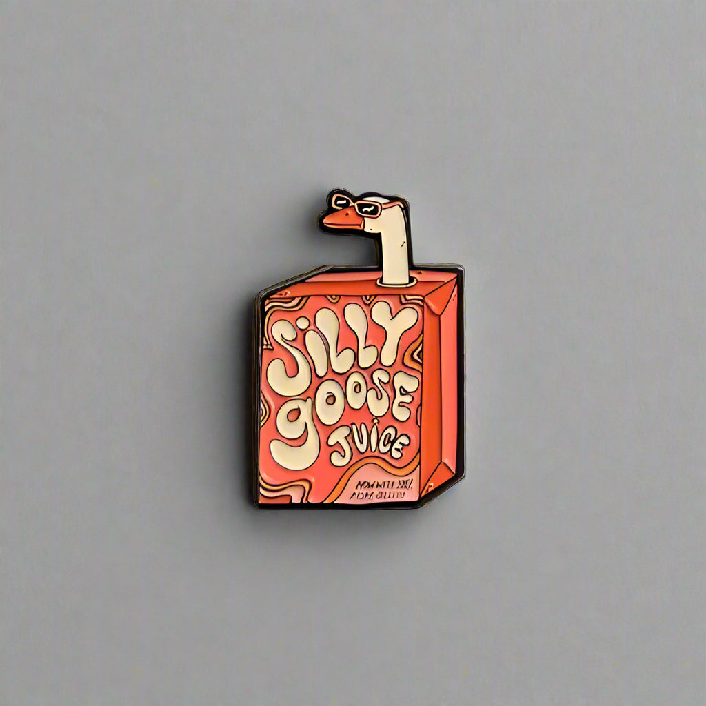 Pin with a cartoon duck holding a box labeled 'Silly Goose Juice' on a gray background