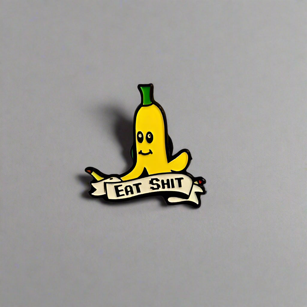 Banana character with 'EAT SHIT' banner on a plain background