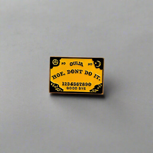 Small yellow and black card with text on a gray surface
