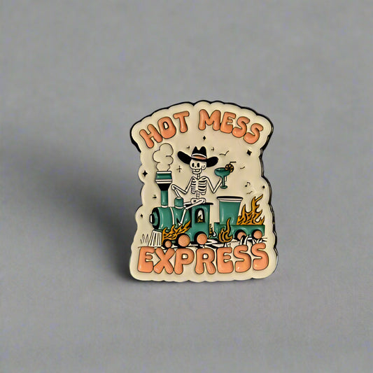 Pin with 'Hot Mess Express' design on a gray background