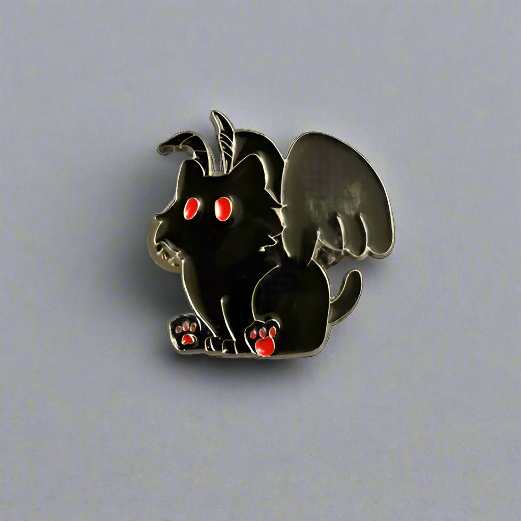 Black cat with red eyes and a tail like a dragon on a gray background
